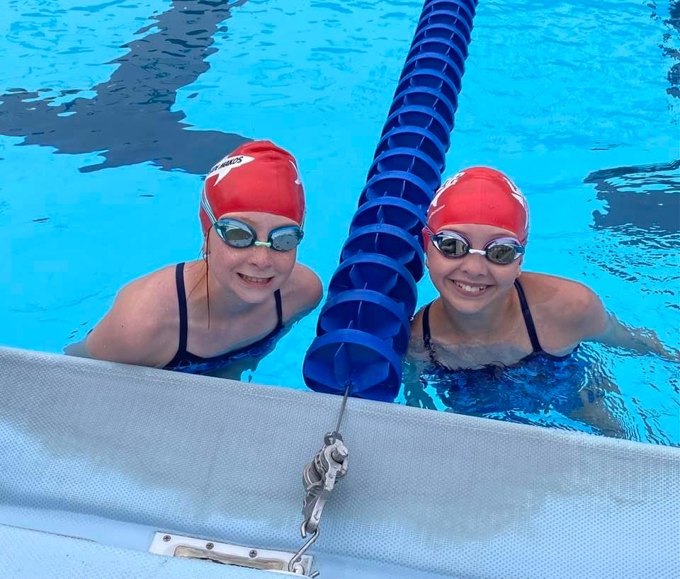 two swimmers in a pool